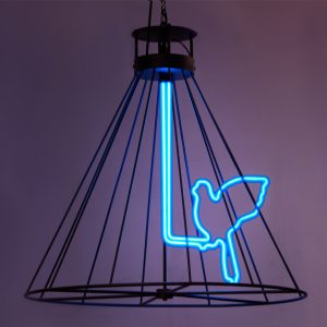 neon blue bird within a metal black hanging cage framework