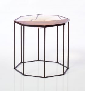 Faceted Tallis table cast in Gold Quartz resin on black powder coated cage-like base/frame.