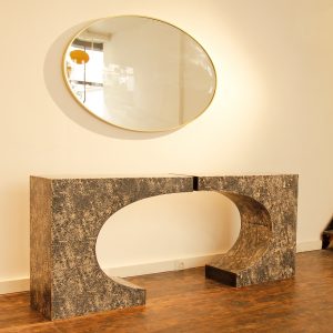 Anvil console table cast in black and white scagliola and can be arranged in two ways. With patinated brass edging.