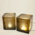 highly polished resin cast plinth illuminated by LED lights inside the textured core