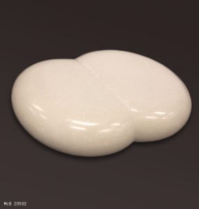 Oval low coffee table cast in white scagliola resembling marble. Double asymmetric version available.