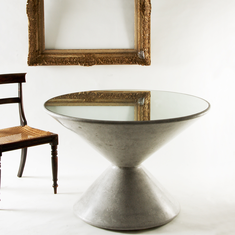 Bobbin shaped centre table cast in cement coloured scagliola and topped with a glass mirror